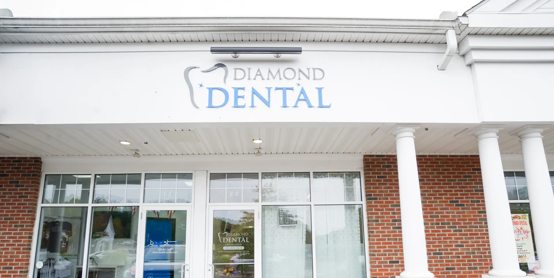 Front view of Diamond Dental office with glass doors and a brick exterior.